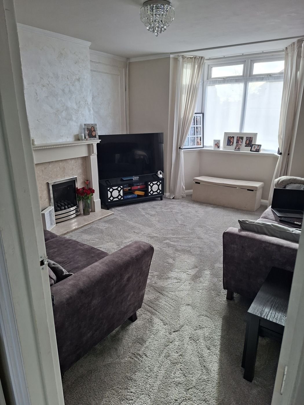 Lounge with a grey fitted carpet
