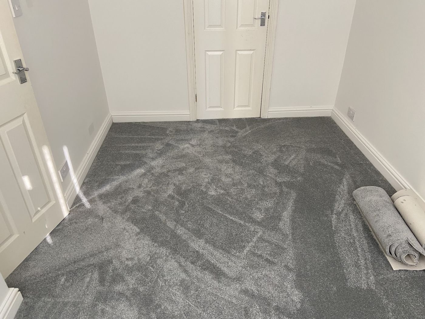 Grey carpet freshly fitted in an upstairs room