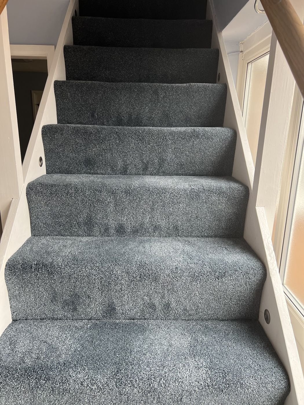 Grey carpet fitted on a staircase