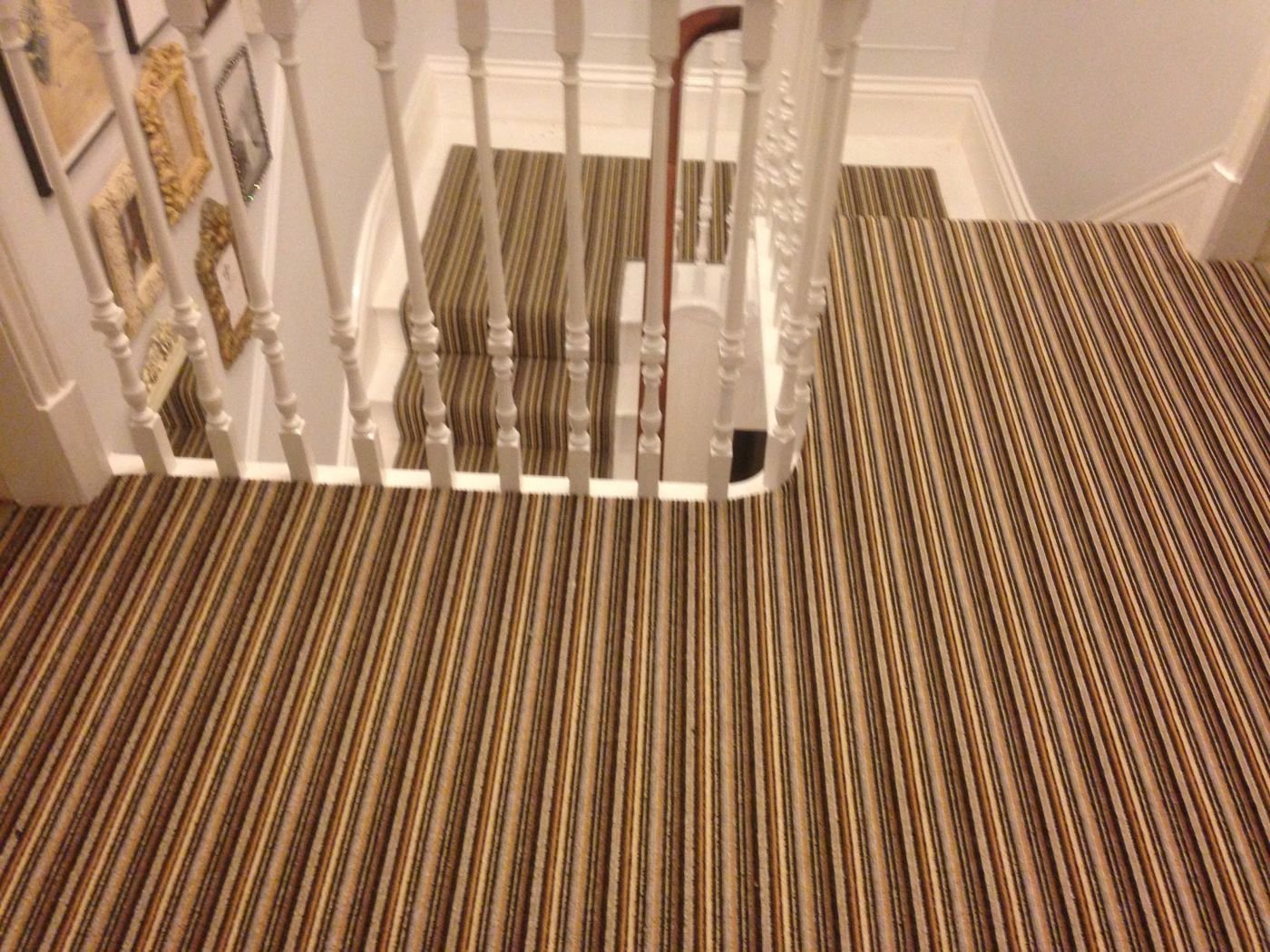 Striped carpet fitted on a staircase and landing